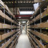 Stockage de pièces détachés équipé de rayonnage tubulaire d'atelier Stockage de pièces détachés équipé de rayonnage tubulaire d'atelier